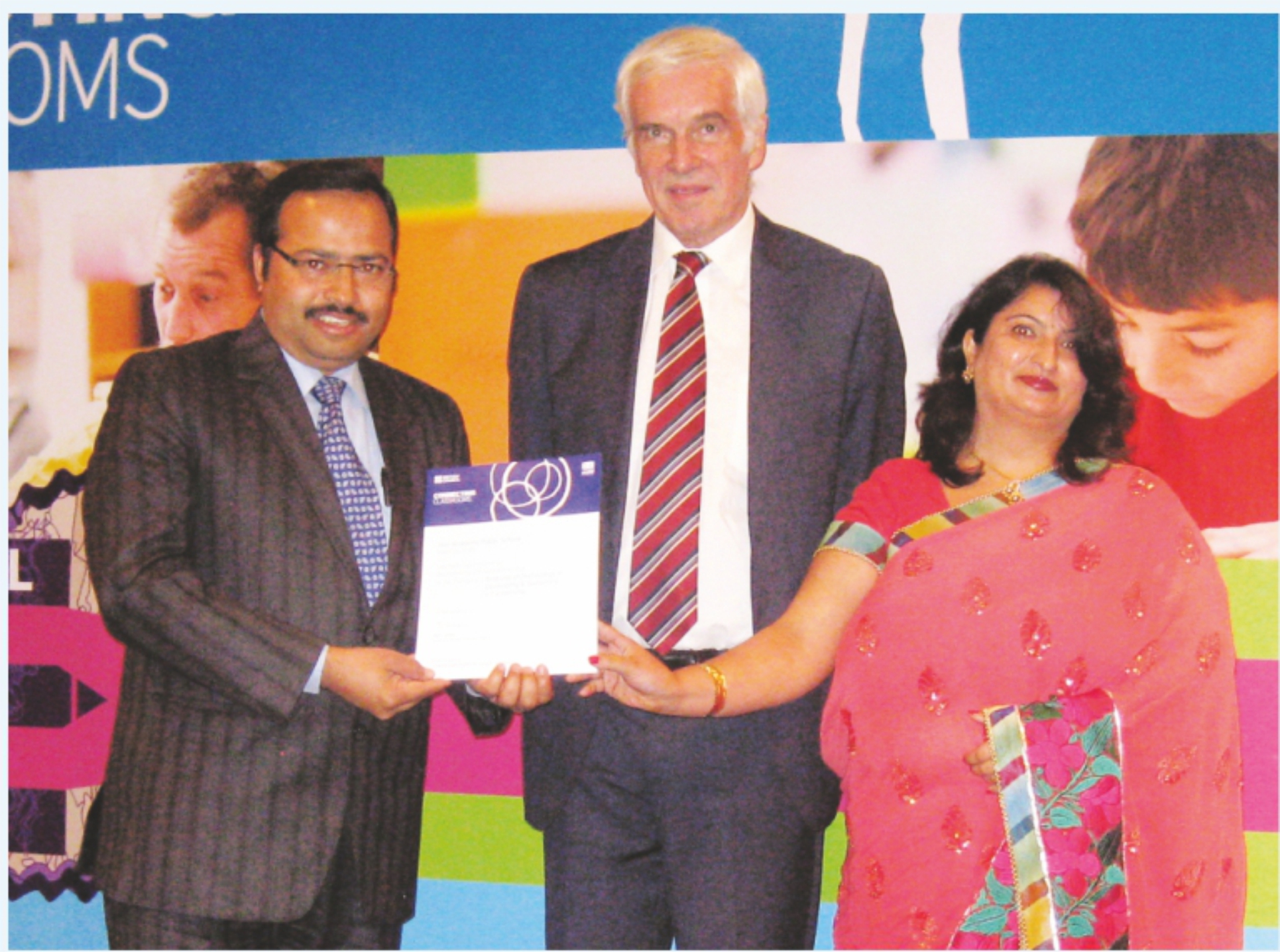 Director (HAPS) and Principal HAPS, Vikas Nagar, receiving " best use of technology in partnerships" award by British Council